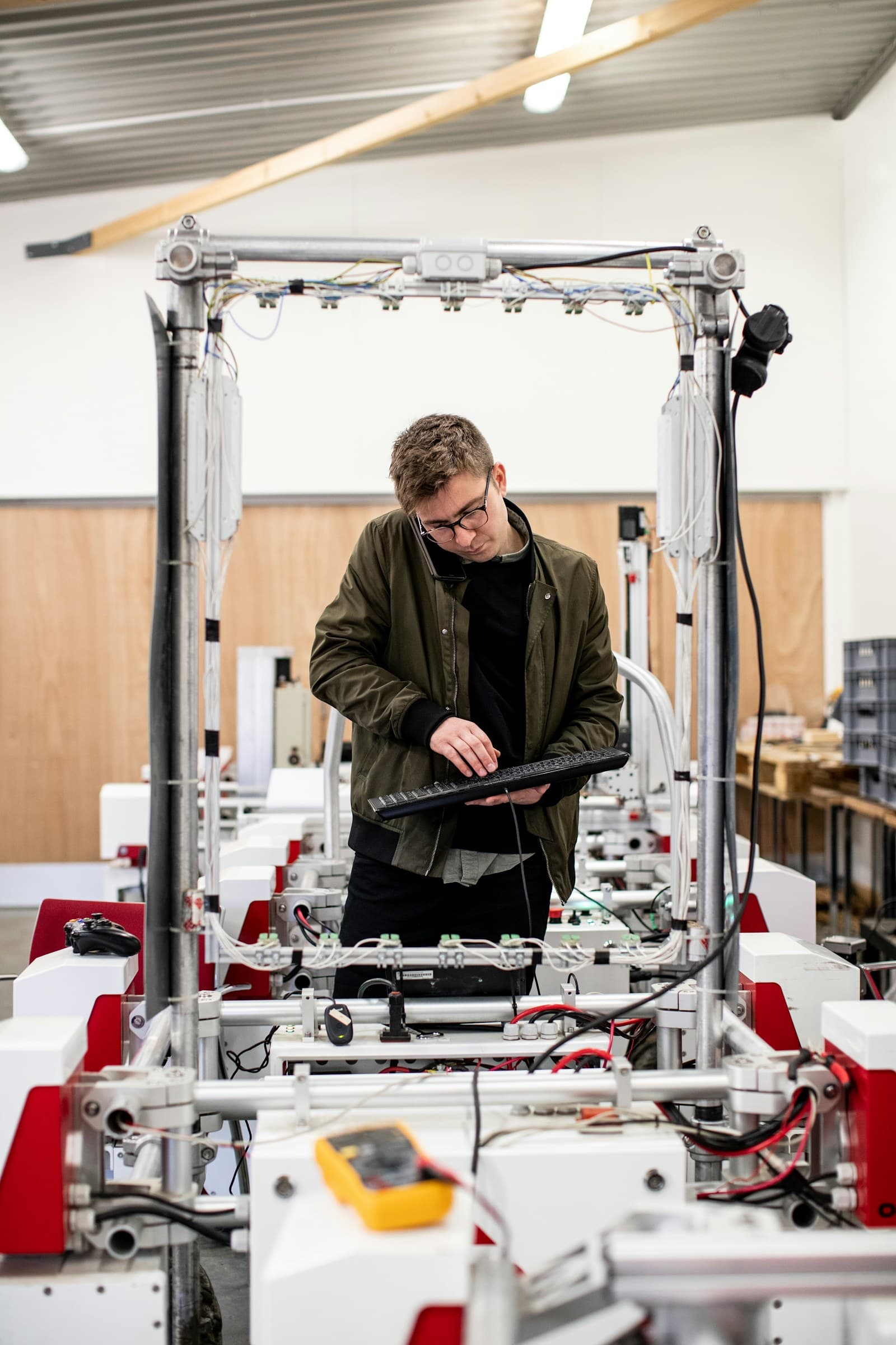 Engineer developing a prototype system in a workshop